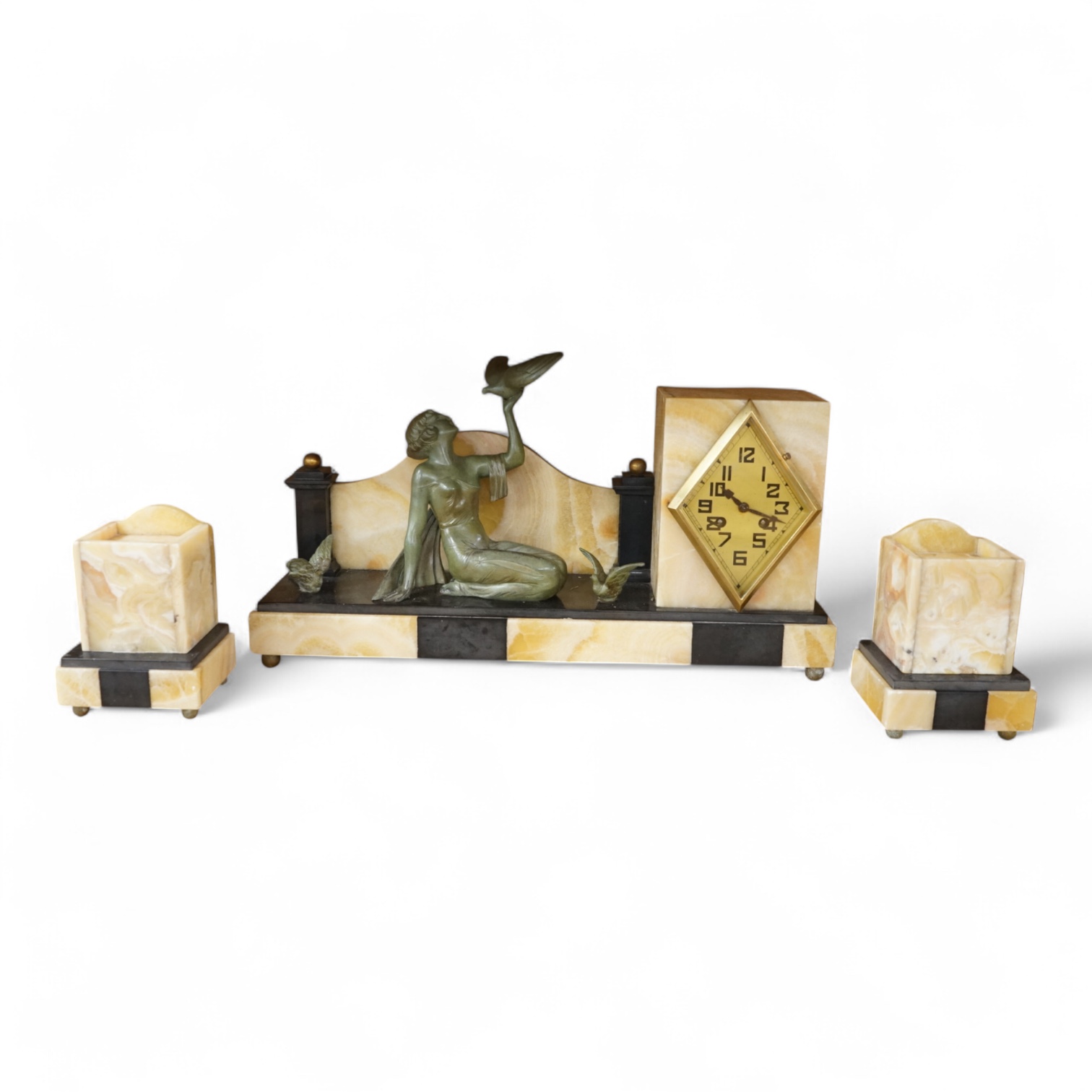 An Art Deco marble and slate clock garniture surmounted with a woman and birds, 52cm wide